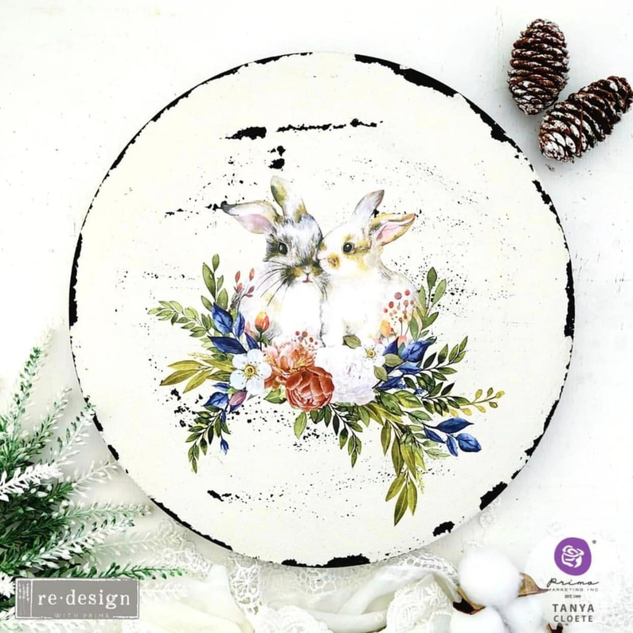 A Lazy Susan refurbished by Tanya Cloete is painted white with black distressed edges and features ReDesign with Prima's Cottontail small transfer on it.