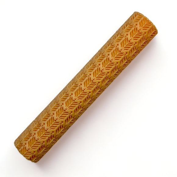 A seamless texture roller featuring an Cacia leaves pattern is against a white background.