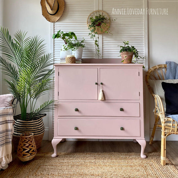A small armoire dresser refurbished by Annie Loveday Furniture features Dixie Belle's Conch Silk All-In-One Mineral Paint.