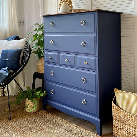 A tall vintage 7-drawer chest dresser refurbished by Annie Loveday Furniture features Dixie Belle's Nautical Silk All-In-One Mineral Paint.