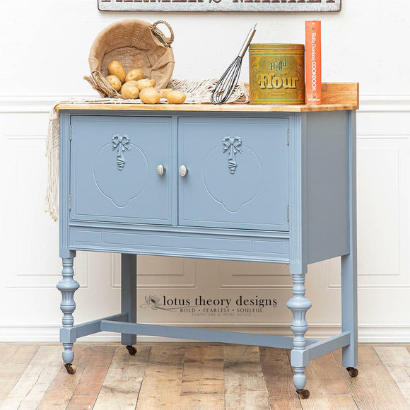 A vintage bar cabinet refurbished by Lotus Theory Designs features Dixie Belle's Quiet Cove Silk All-In-One Mineral Paint.