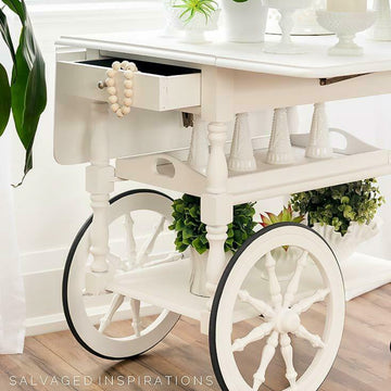 A vintage wood bar cart refurbished by Salvaged Inspirations features Dixie Belle's Salt Water Silk All-In-One Mineral Paint.