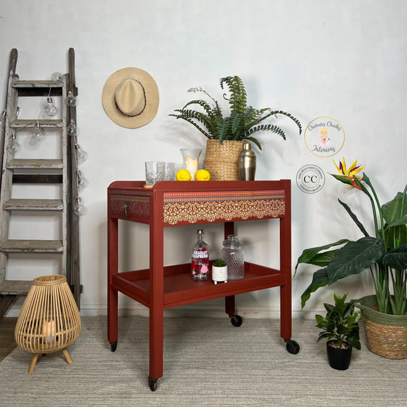 A vintage bar cart refurbished by Cherubs Chalks Interiors features Dixie Belle's Sequoia Silk All-In-One Mineral Paint.