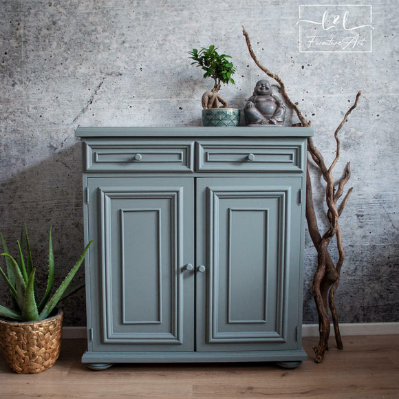 A small buffet cabinet refurbished by L&L Furniture Art features Dixie Belle's Wharf Silk All-In-One Mineral Paint.