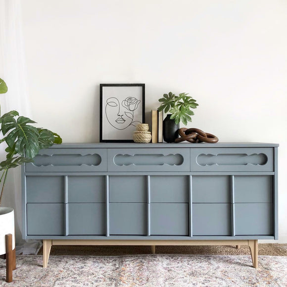 A large tv console with storage features Dixie Belle's Wharf Silk All-In-One Mineral Paint.