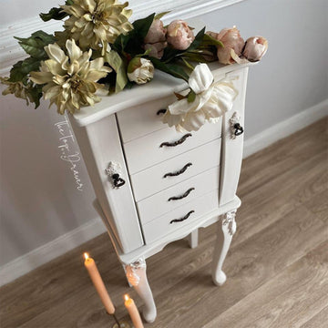 A vintage standing jewelry armoire refurbished by The Top Drawer is painted in Dixie Belle's Magnolia Chalk Mineral Paint.