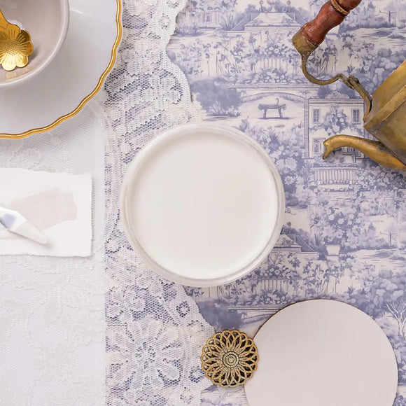 white paint on a blue patterned table.