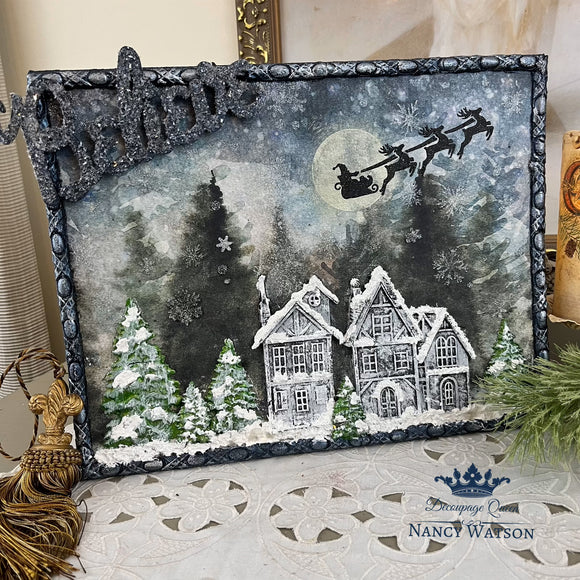 A framed canvas craft created by Nancy Watson has a winter scene and features LaBlanche's Houses 2 silicone mold castings on it.