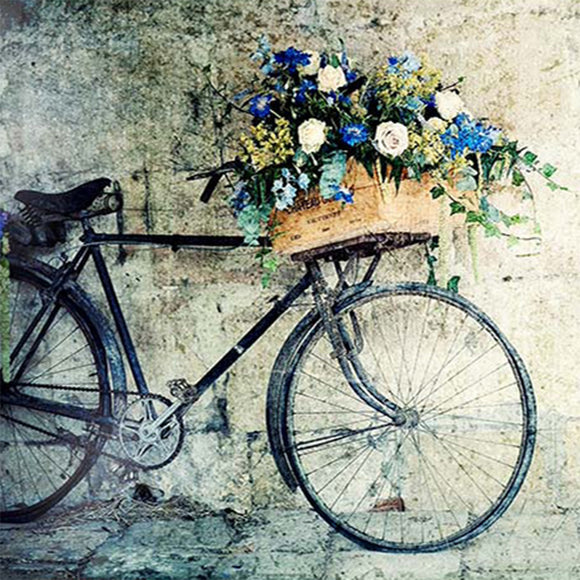 Close-up of a rice paper design that features a vintage bicycle adorned with a basket of beautiful blue and white roses.