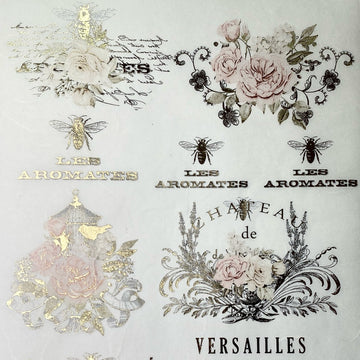Close-up of an A4 rice decoupage paper featuring floral designs, birdcages, and French writing highlighted with foil gilding.