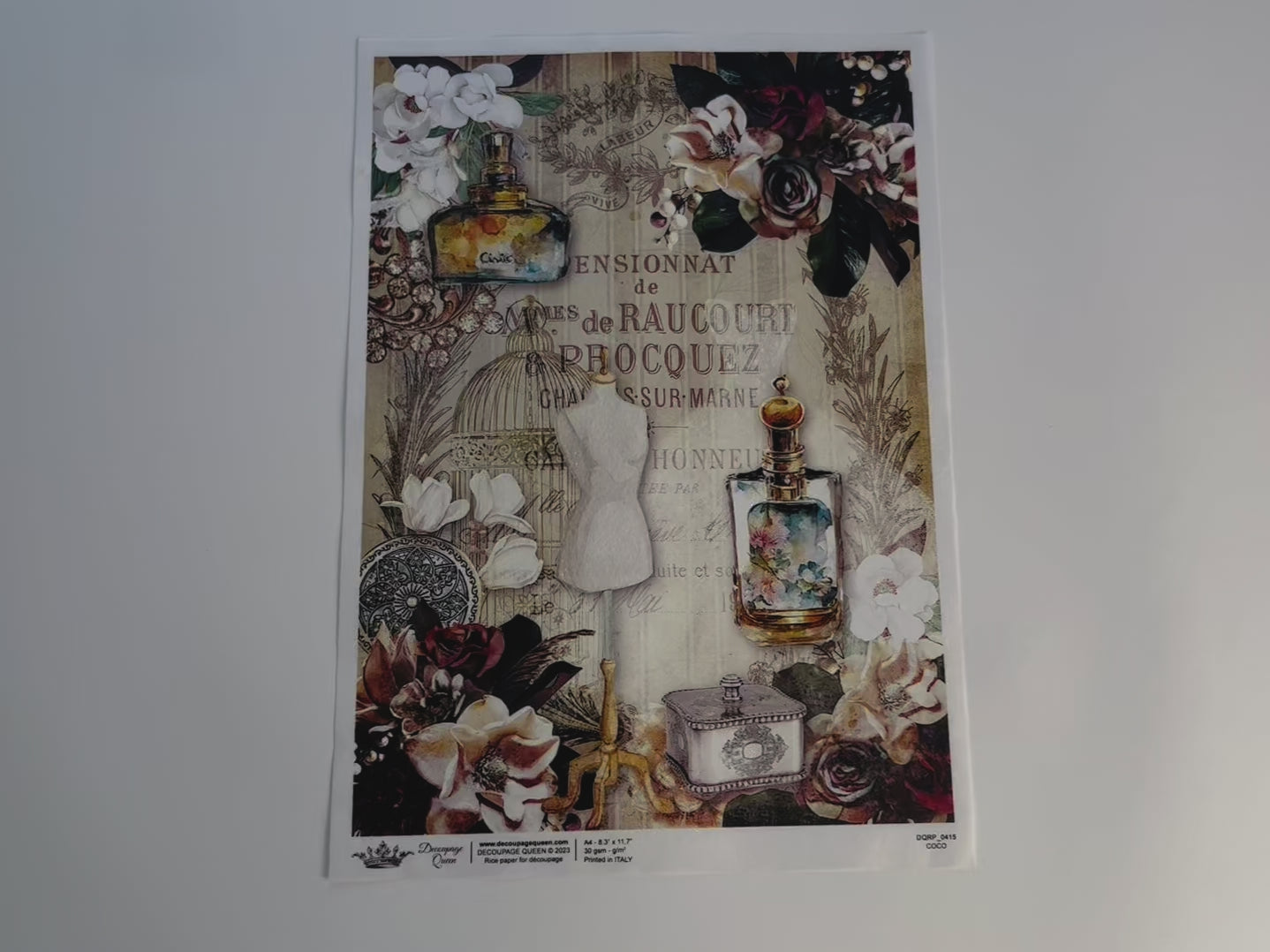 A 10 second video shows a close-up and hand lifting the bottom right hand corner of Decoupage Queen's Coco A4 rice paper against a white background.