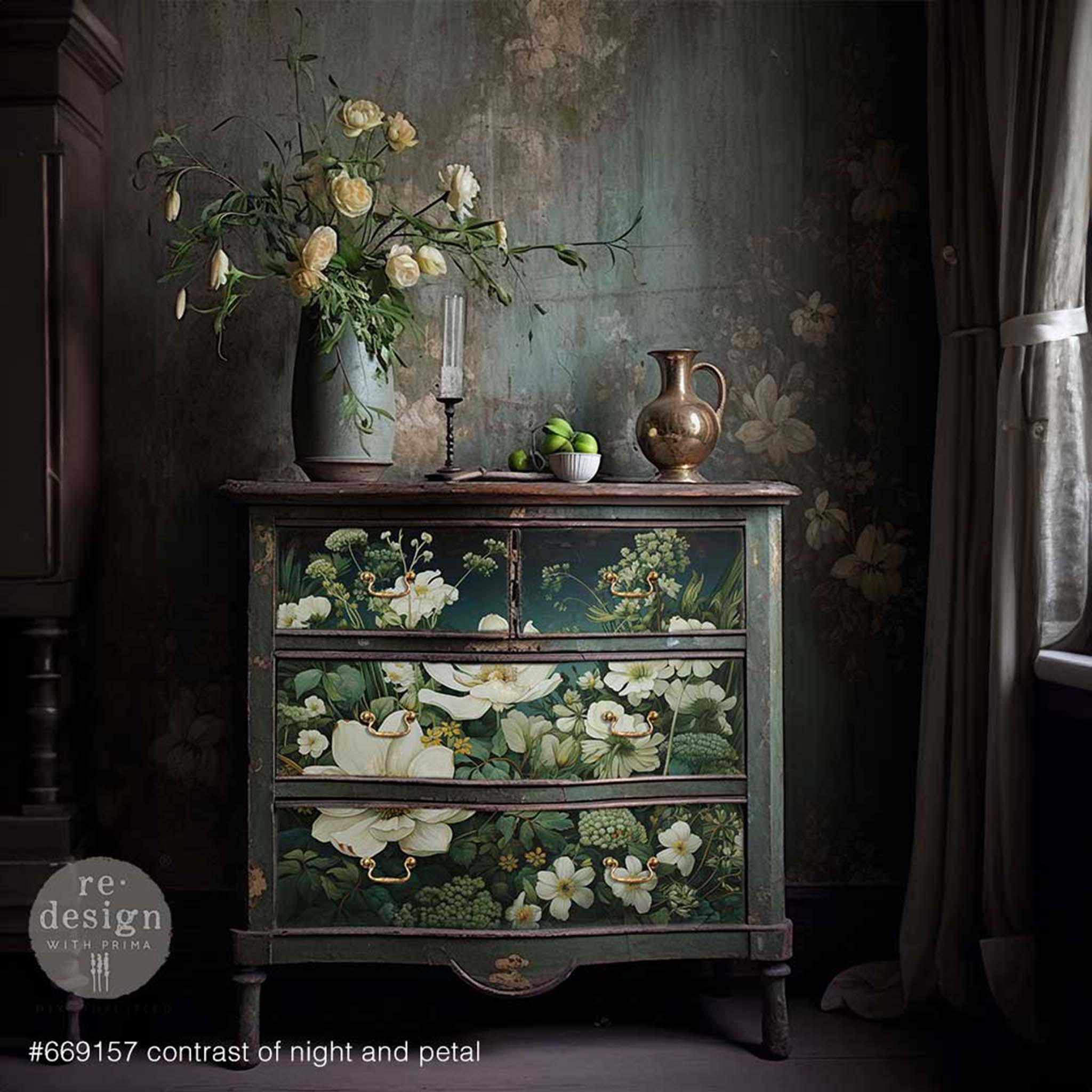 A vintage dresser is painted deep green and features ReDesign with Prima's Contrast of Night and Petal A1 fiber paper on its 4 drawers.