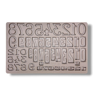 Silicone mold with letter and number stamps on a white background