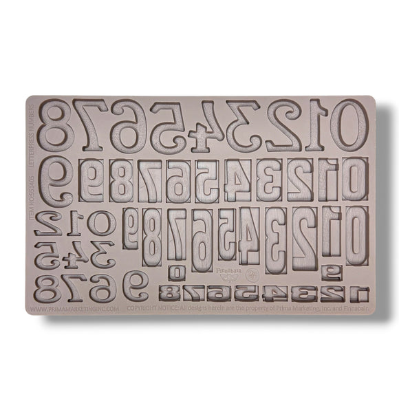 Silicone mold with letter and number stamps on a white background