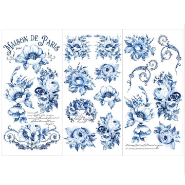 Three sheets of rub-on transfers featuring elegant florals in rich cobalt blue and French script are against a white background.