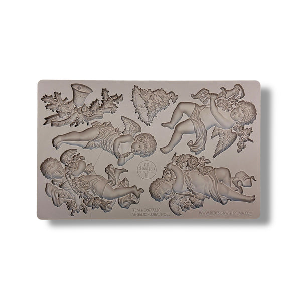 Silicone mold with angel and floral designs on a white background
