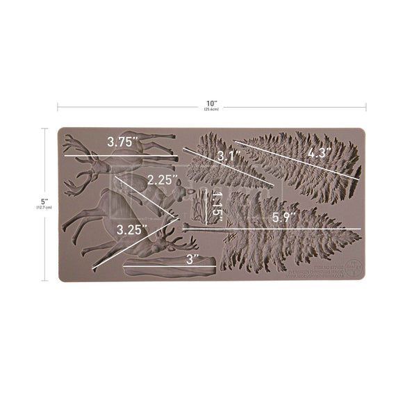 Silicone mold with deer and leaf designs and measurements on a white background