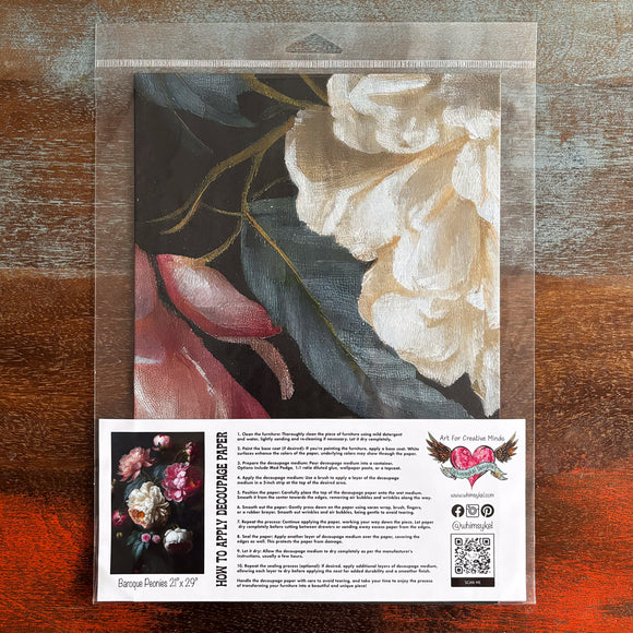 A package of Whimsykel's Baroque Peonies and Roses tissue paper is against a dark wood background.
