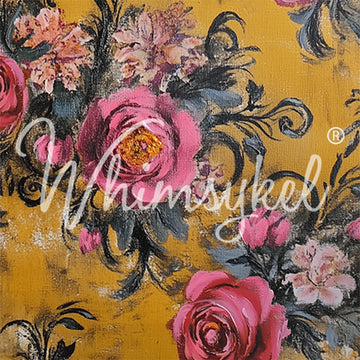 Close-up of a tissue paper featuring paintings of pink rose bouquets against a mustard yellow background.
