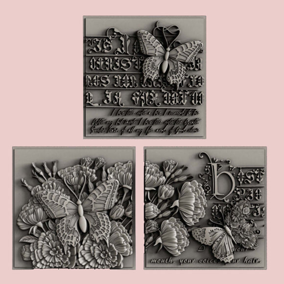 Silver colored castings of 3 tiles featuring butterflies, flowers and calligraphy are against a light pink background.
