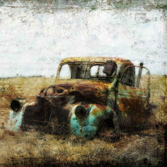 Close-up of a rice paper featuring a decaying old farm truck out in a field.