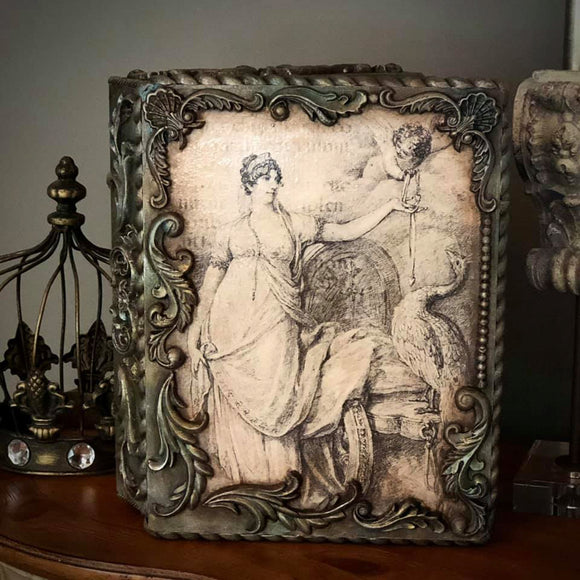 Ornate decor piece with the Juno and Cupid decoupage paper on top.