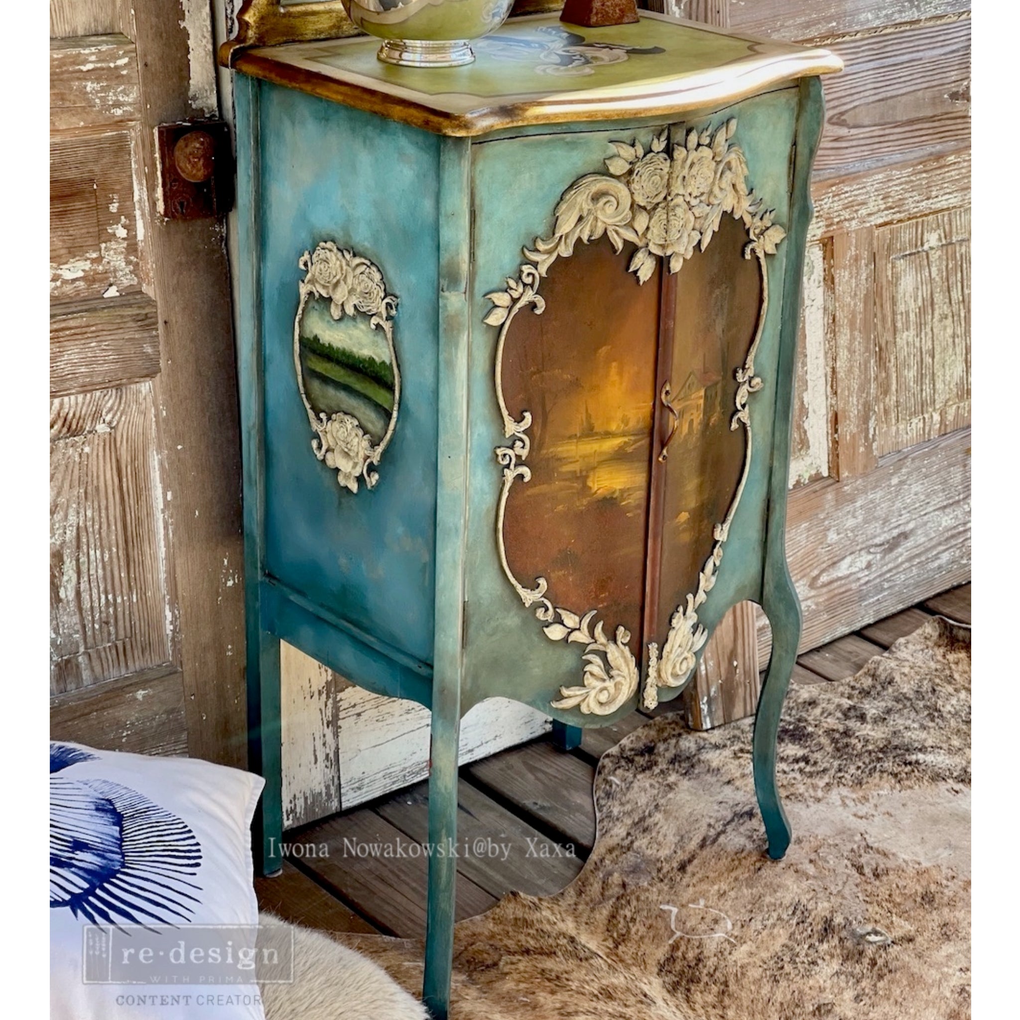 Side view of a vintage small armoire refurbished by Iwona Nowakowski @ by Xaxa is painted teal-blue and features ReDesign with Prima's Victorian Rose silicone mould around an antique brown decoupage paper design.