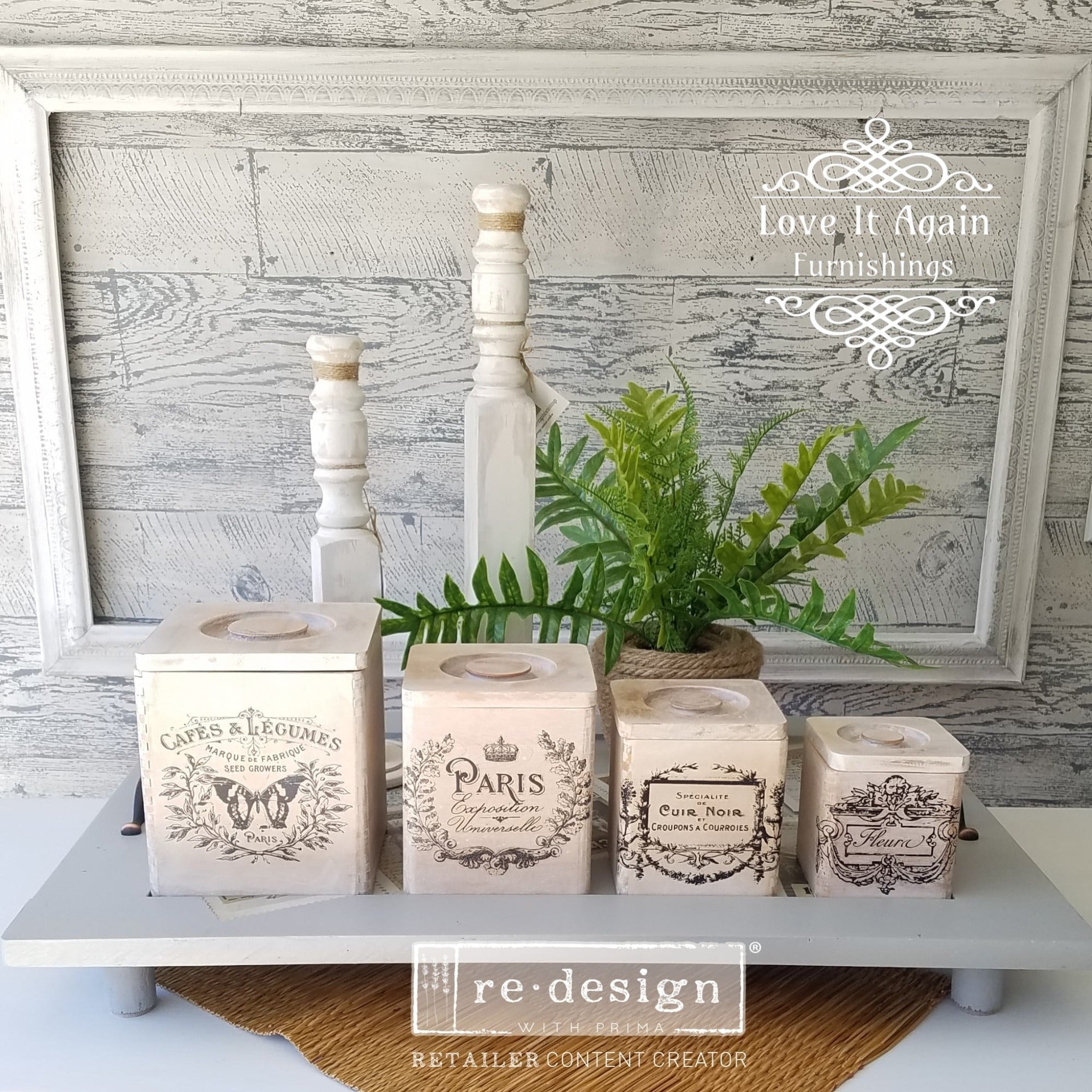 Four counter top dry storage sqaure containers refurbished by Love it Again Furnishings are painted light beige and feature ReDesign with Prima's Classic Vintage Labels transfer on them.