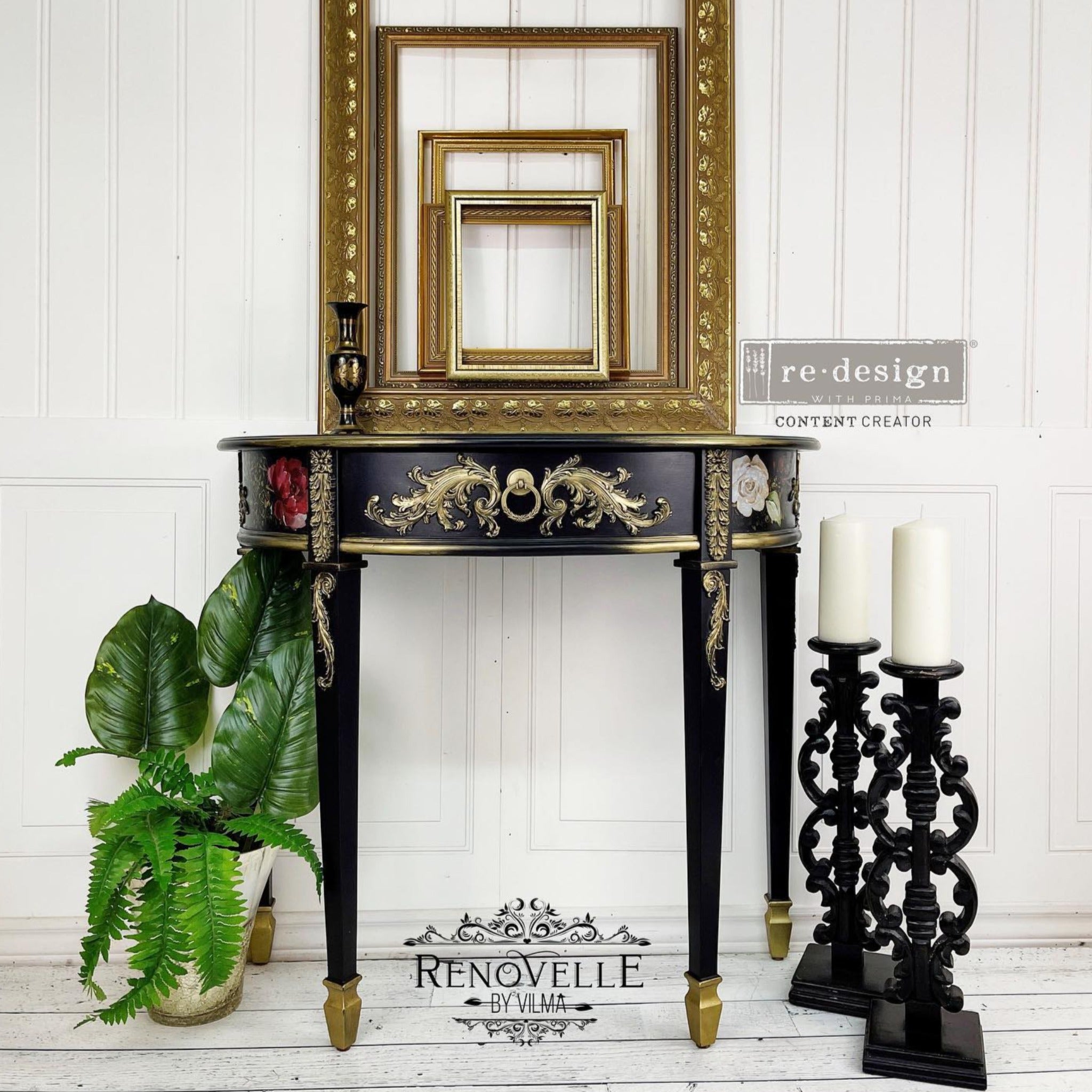 A vintage half circle entryway table refurbished by Renovelle by Vilma is painted black with gold accents and features ReDesign with Prima's Midnight Floral transfer on the sides.