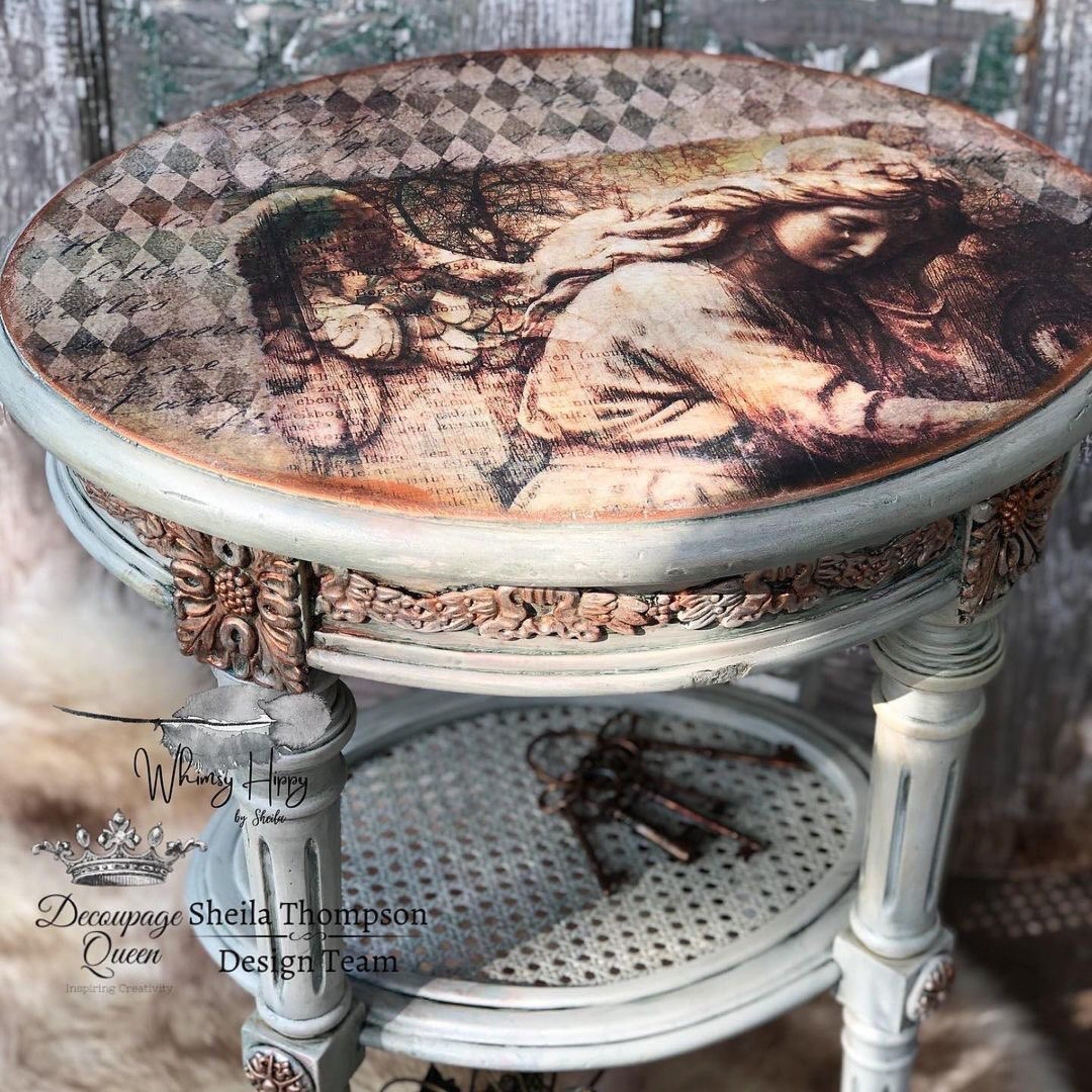 A vintage round side table refurbished by Whimsy Hippy by Sheila is painted light grey and features Decoupage Queen's Neutral Harlequin rice paper on the table top. Decoupage Queen's Gothic Angel rice paper is also featured with Neutral Harlequin.
