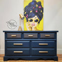 A 7-drawer dresser refurbished by Flipping Fabulous is painted blue and features ReDesign with Prima's Motif Geometrique small transfer on its top 3 small drawers.