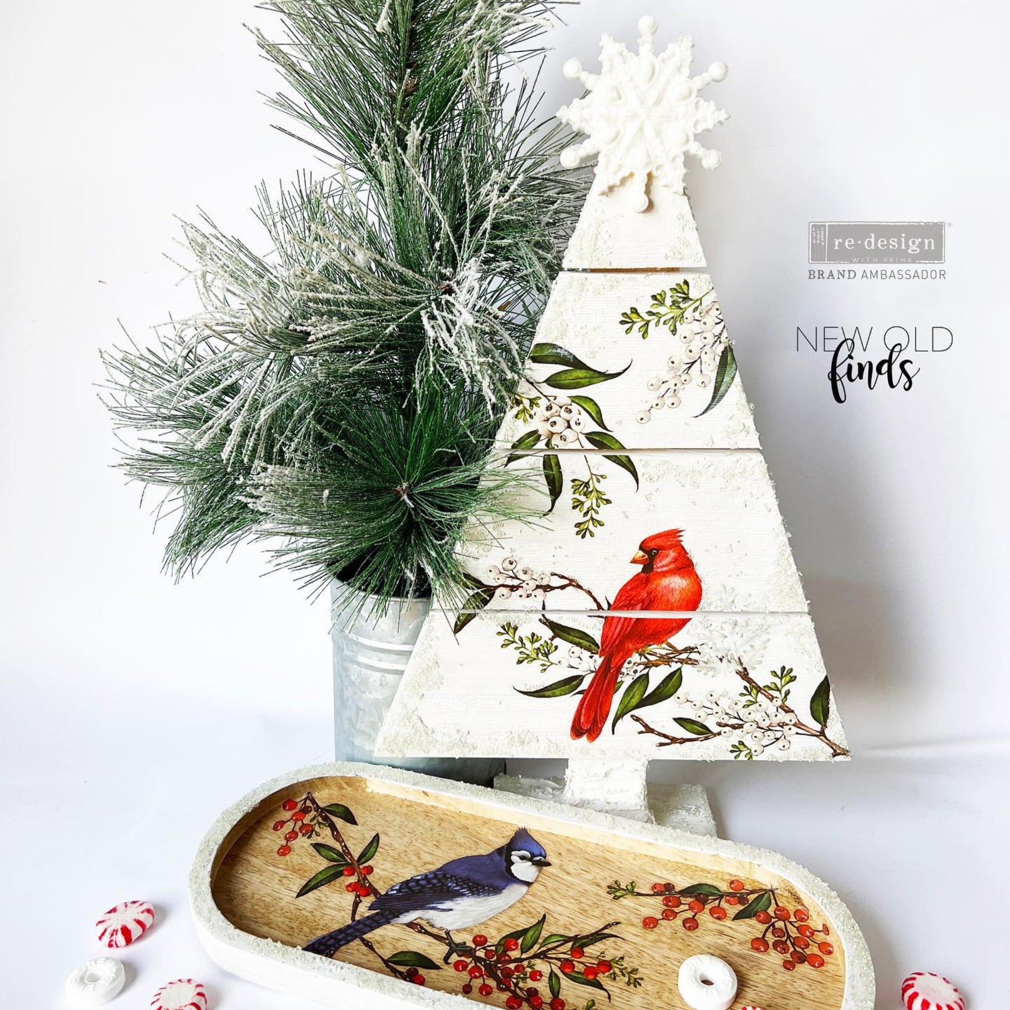 A white painted wood Christmas tree craft and small oval serving tray refubished by New Old Finds feature ReDesign with Prima's Winterberry small transfer on them.