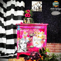 A 2-drawer nightstand refurbished by CeCe ReStyled is painted bright pink and features ReDesign with Prima's Abstract Beauty tissue paper on it.