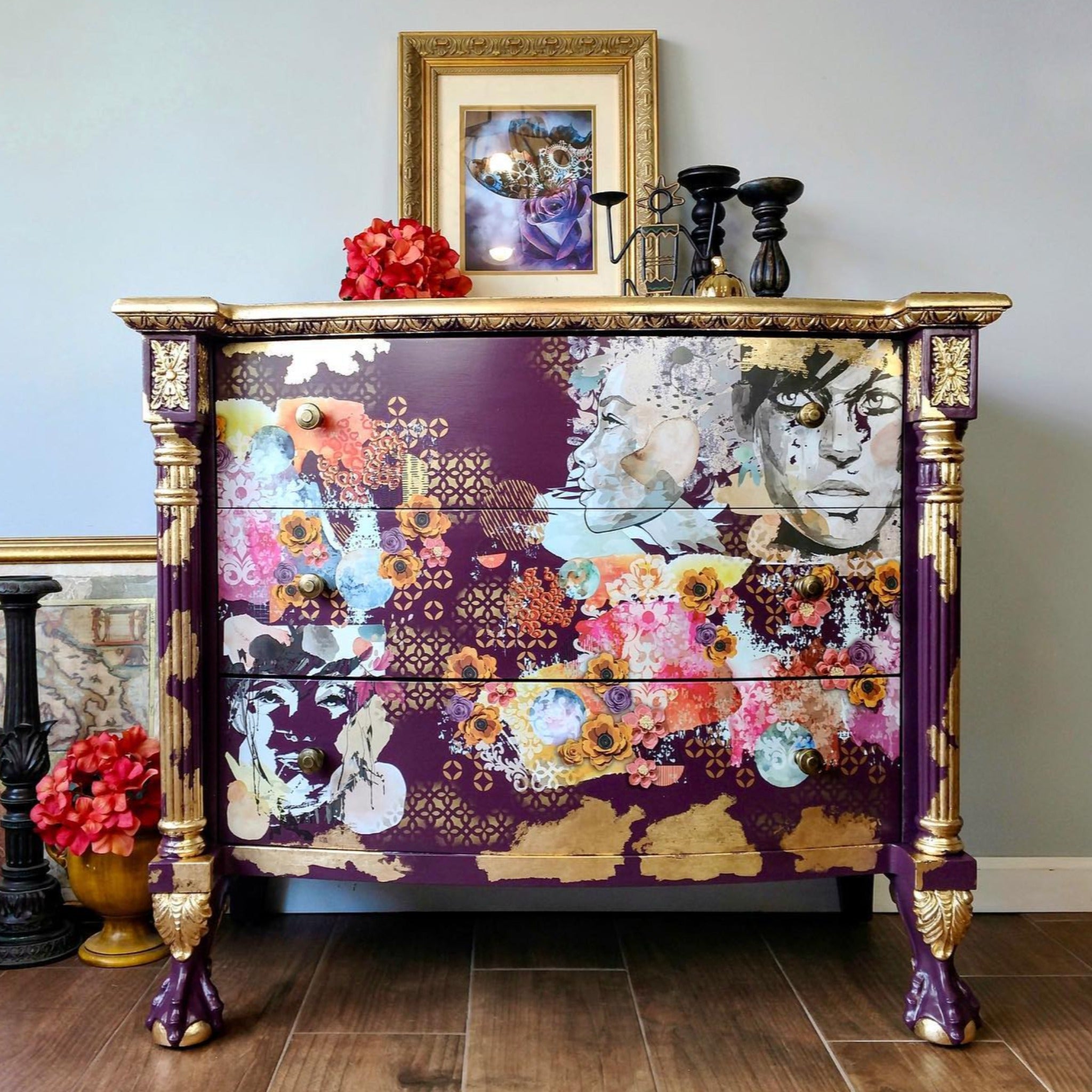 A vintage 3-drawer dresser is painted royal purple with gold accents and features ReDesign with Prima's Abstract Beauty tissue paper on its drawers. 