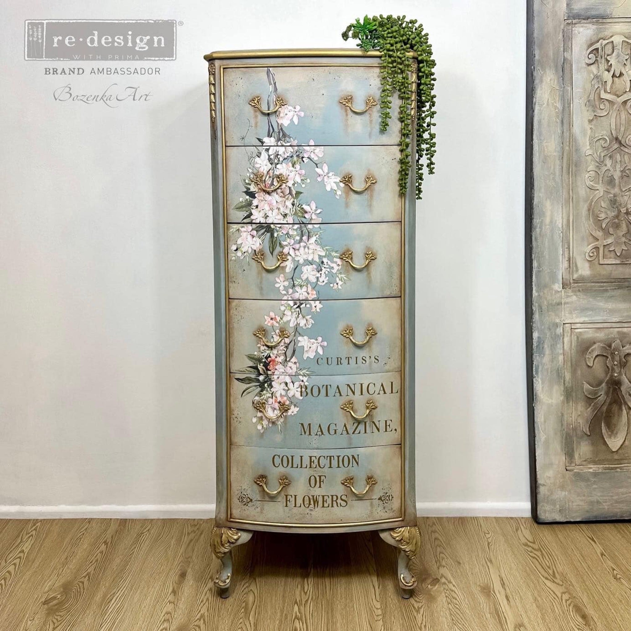 A vintage lingerie 6-drawer dresser refurbished by Bozenka Art is painted a faux patina green and features ReDesign with Prima's Blossom Botanica on its drawers.
