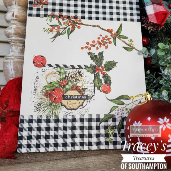 A cutting board refurbished by Tracey's of Southampton features black plaid edges and ReDesign with Prima's Winterberry small transfer on it along with another Christmas transfer.