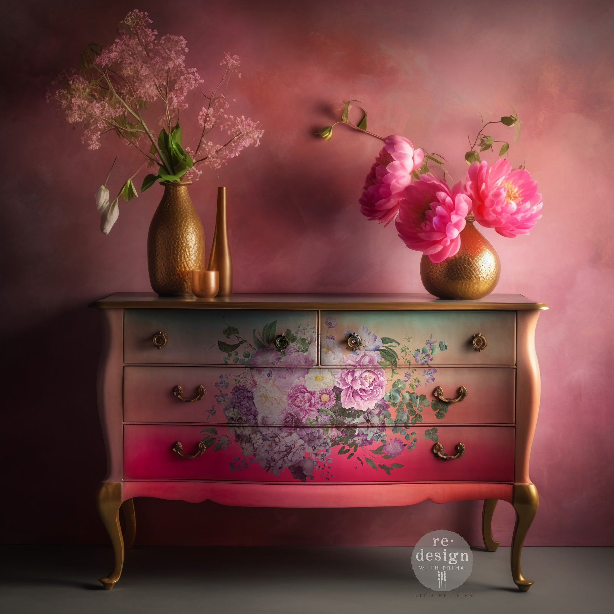 A vintage 4 drawer dresser is painted an ombre blend of coral pink and light green and features ReDesign with Prima's Kacha Morning Purple in the center of the drawers.