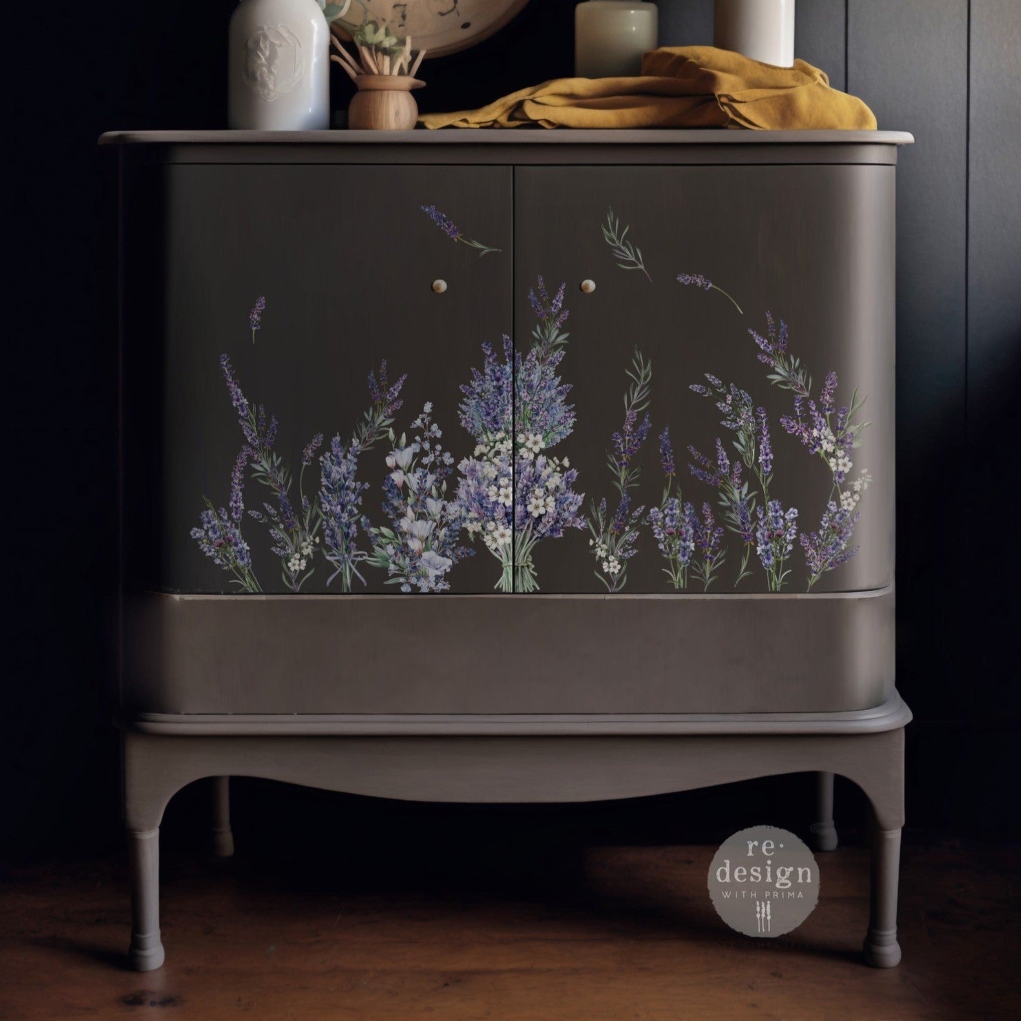 A small buffet table is painted medium grey and features ReDesign with Prima's Lavender Bunch small transfer on its 2 drawers.