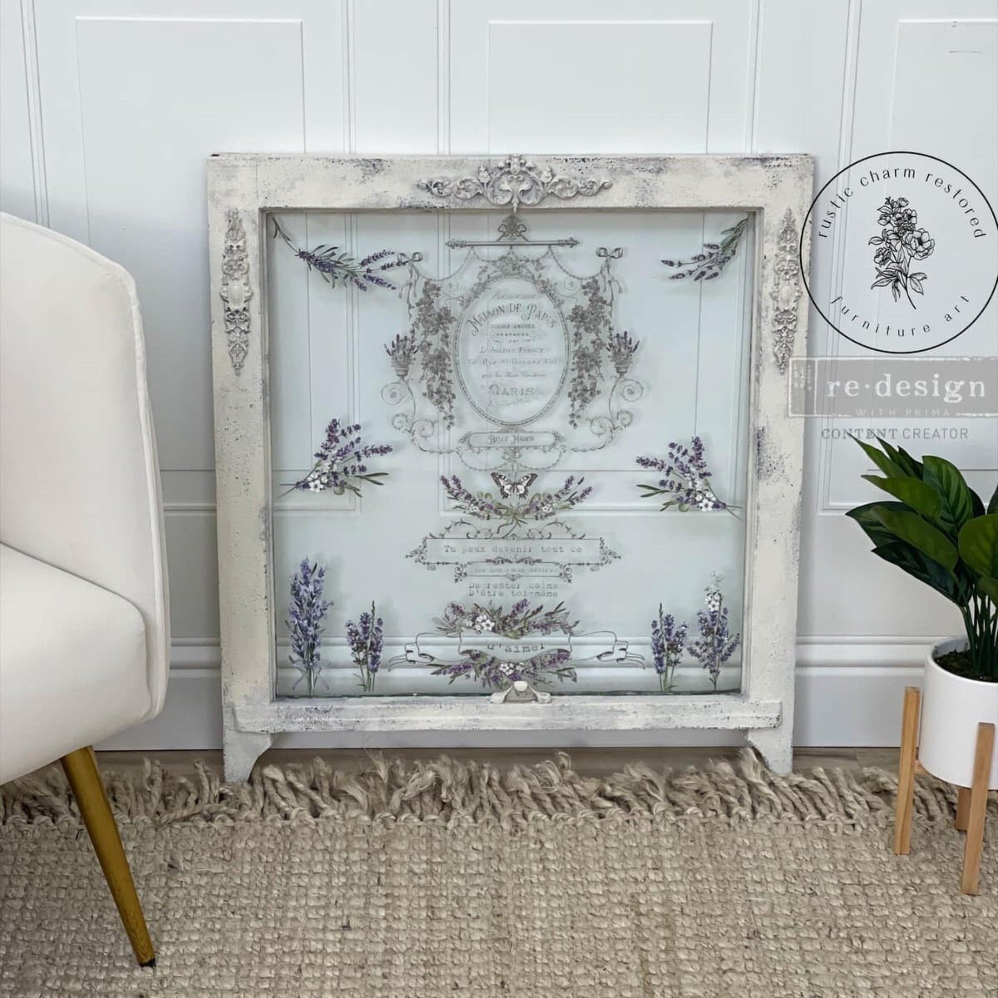 A sqaure wood framed piece of window glass features ReDesign with Prima's Lavender Bunch small transfer on the glass.