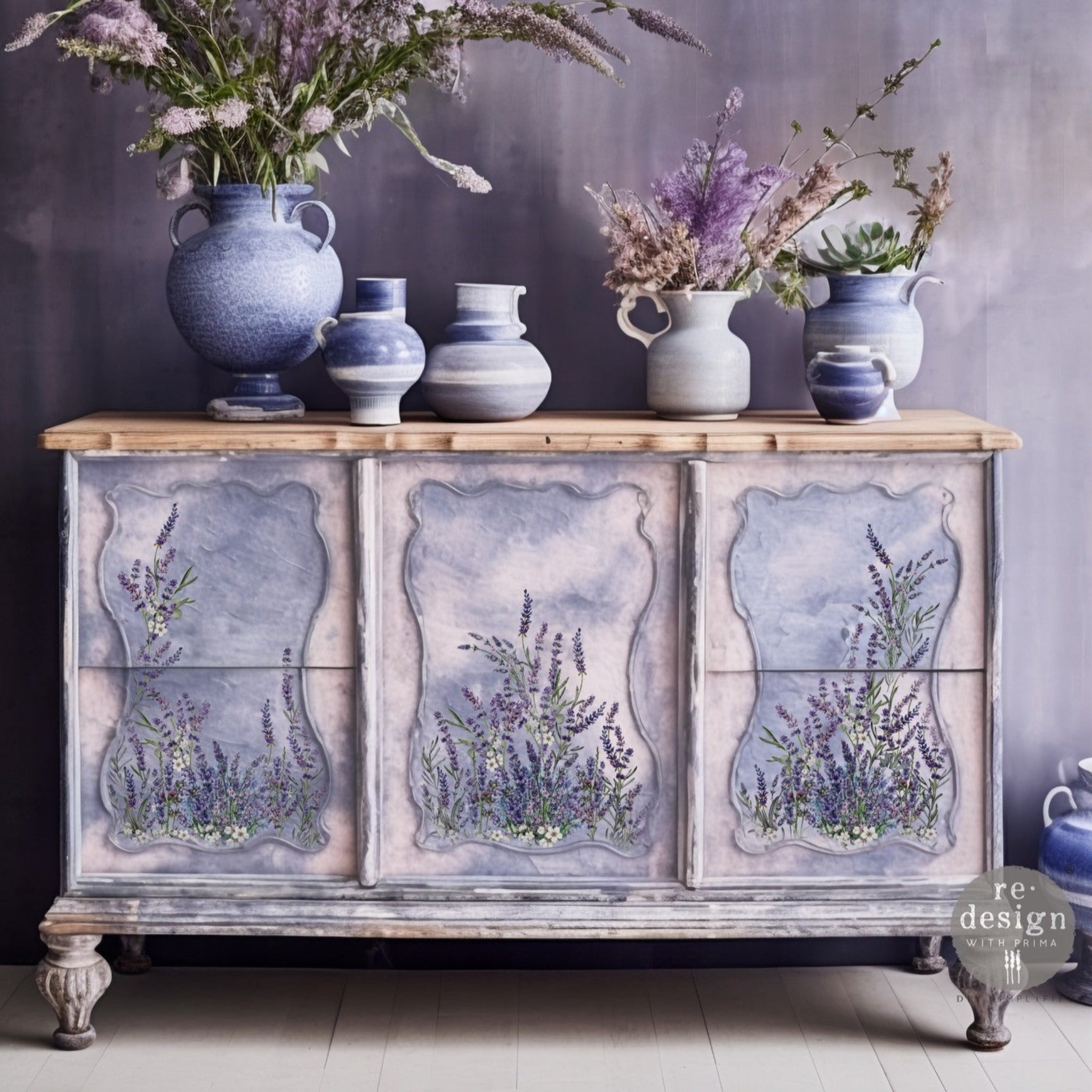 A buffet table a blend of white and light blue and features ReDesign with Prima's Lavender Bunch small transfer on the front panel inlays.