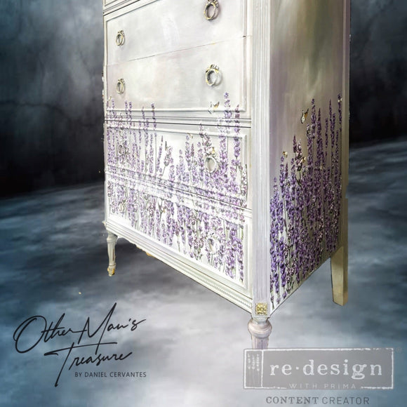 A vintage tall chest dresser refurbished by Other Man's Treasure is painted pale yellow and features ReDesign with Prima's Champs de Lavende transfer around the bottom.