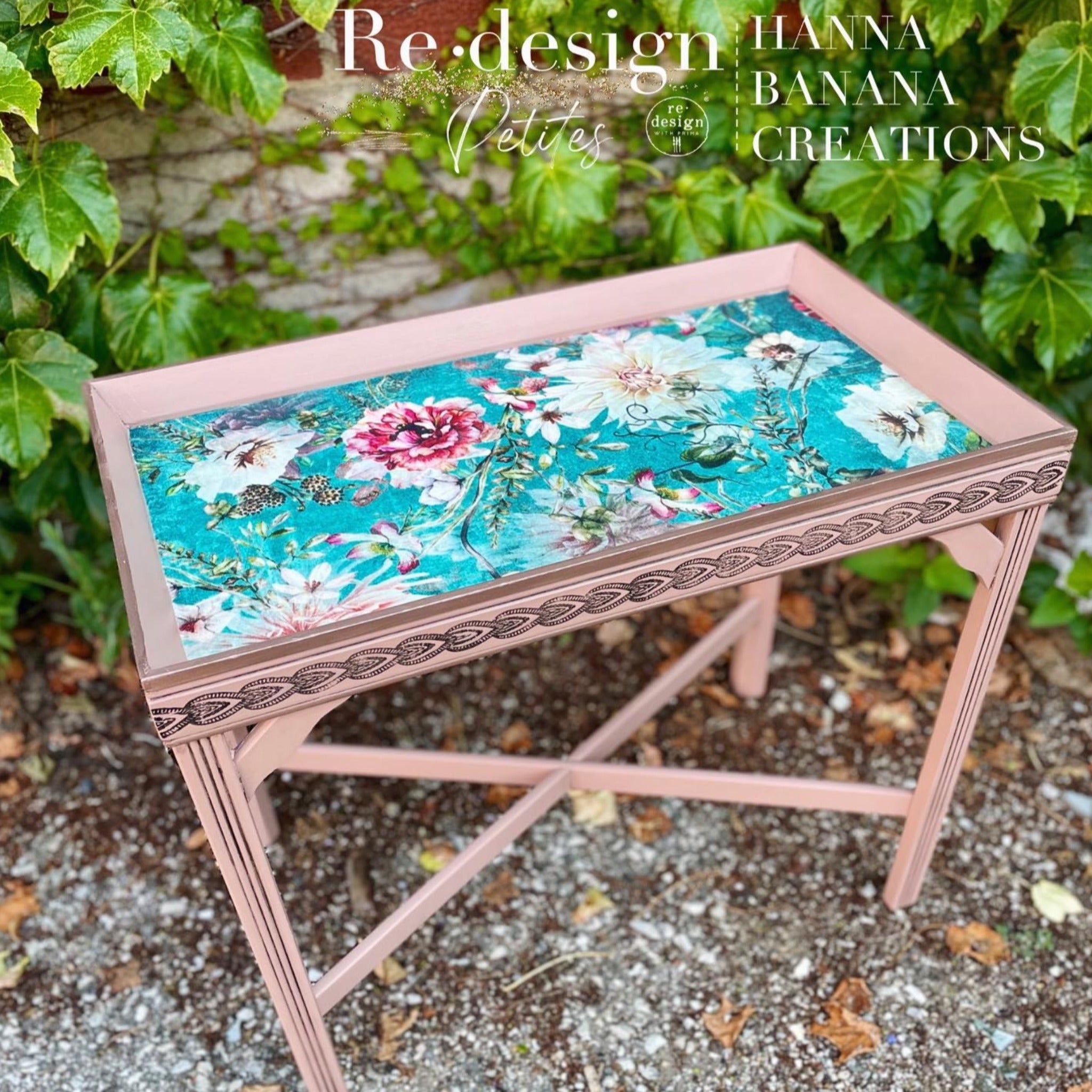 A vintage tray table refurbished by Hanna Banana Creations is painted mauve and features ReDesign with Prima's Discovering Dahlias tissue paper on the table inlay.