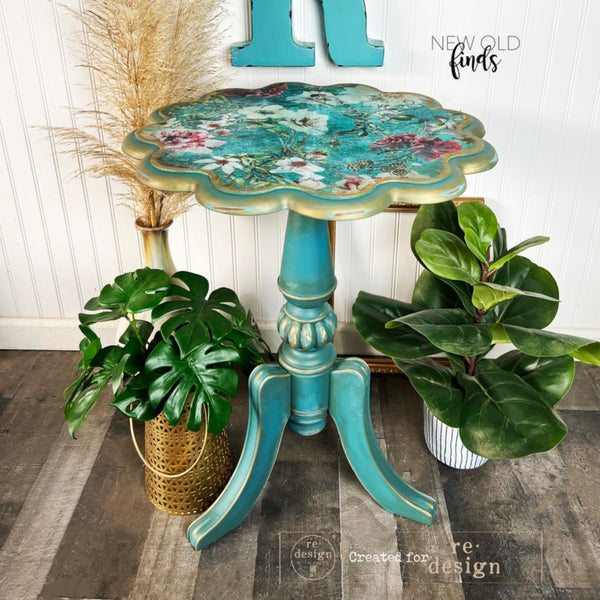 A vintage wooden plant stand table refurbished by New Old Finds is painted turquoise with gold accents and features ReDesign with Prima's Discovering Dahlias tissue paper on the table top.
