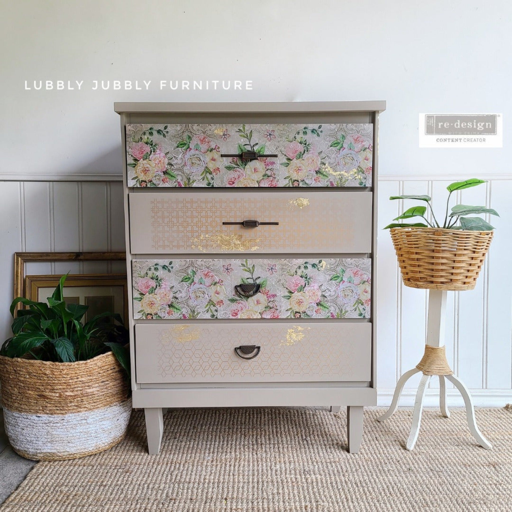 A 4-drawer dresser refurbished by Lubbly Jubbly Furniture is painted light beige and features ReDesign with Prima's Motif Geometrique small transfer on its 2nd and 4th drawer. A floral transfer is on the other 2 drawers.