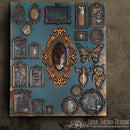 A sqaure wood wall decoration created by Lotus Theory Designs is painted blue and features ReDesign with Prima's Clio silicone mould castings in antique gold color. Other silicone mould castings decorate the wood also.