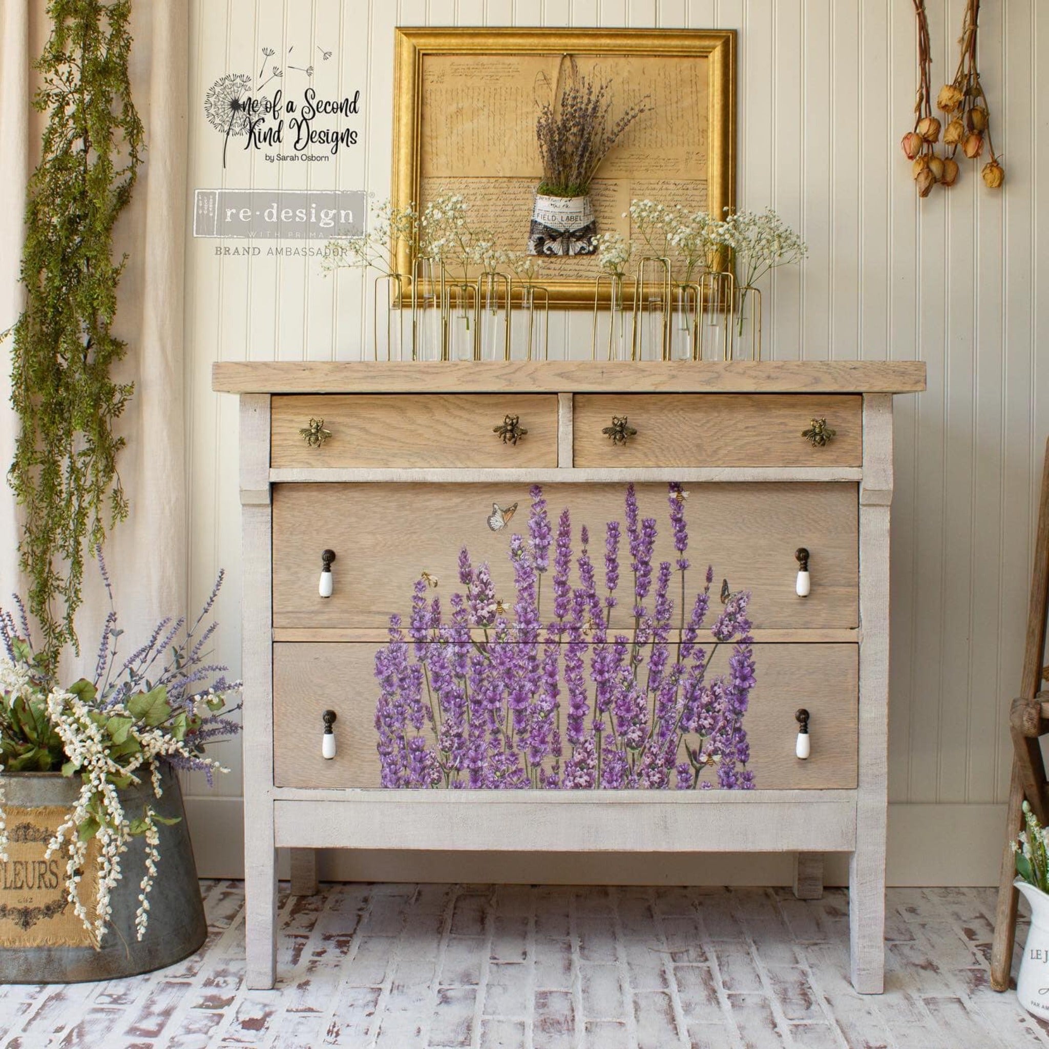 A natural light wood dresser refurbished by One of a Second Kind Designs features ReDesign with Prima's Champs de Lavende transfer on its 2 bottom drawers.