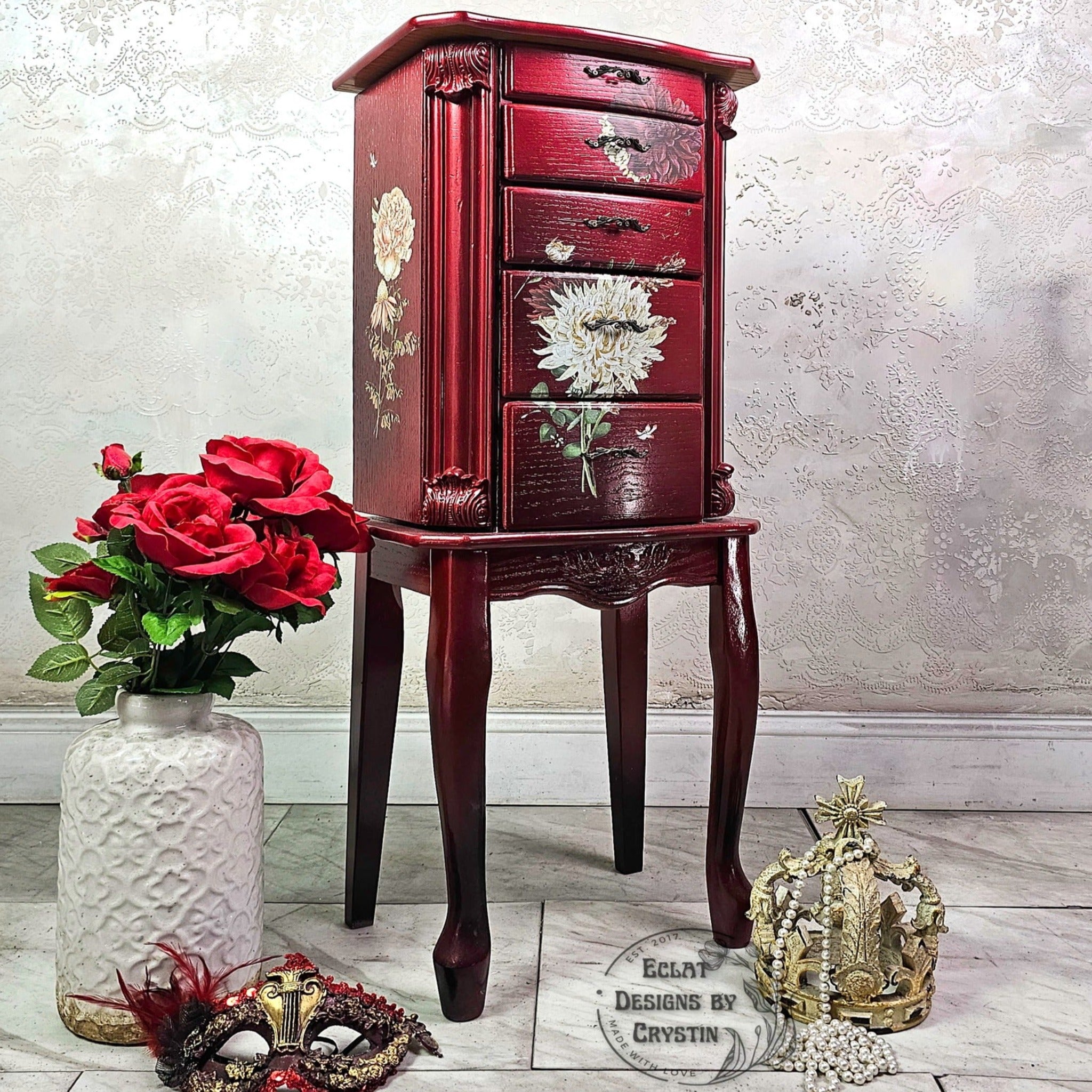 A vintage standing jewelry armoire refurbished by Eclat Designs by Crystin is painted dark cherry red and features ReDesign with Prima's Willow Way small transfer on the front and sides.