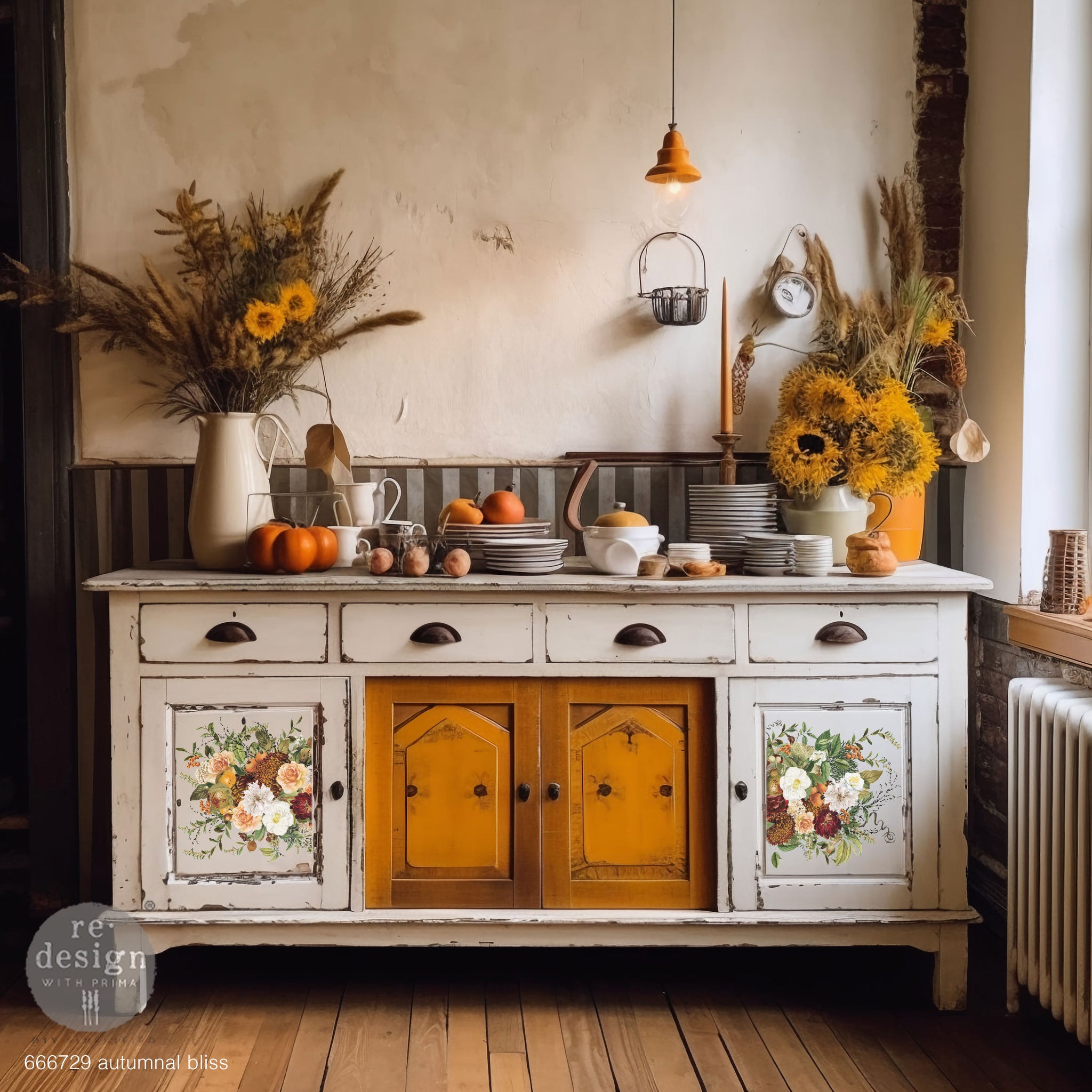 A vintage buffet table is painted soft white and features ReDesign with Prima's Autumnal Bliss 12"x12" transfer on 2 of its doors.