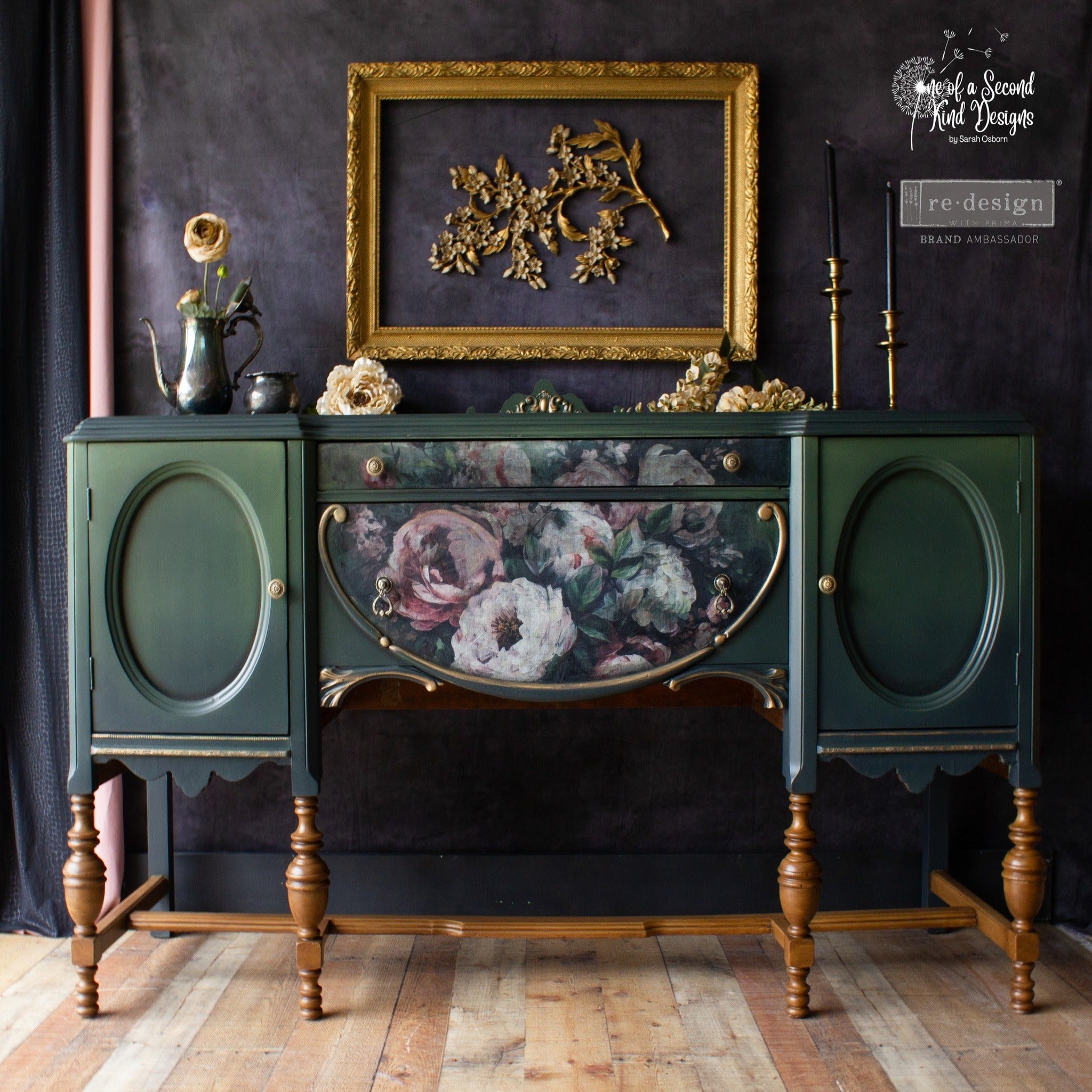 A vintage vanity desk refurbished by One Of A Second Kind Designs is painted dark green and features ReDesign with Prima's Mossy Rose Delight A1 fiber paper on its front center small drawer and panel.