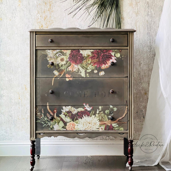 A vintage 4-drawer chest dresser refurbished by Click 2 Restore is painted brown and features ReDesign with Prima's Rustic Charm transfer on its 2nd and bottom drawer.